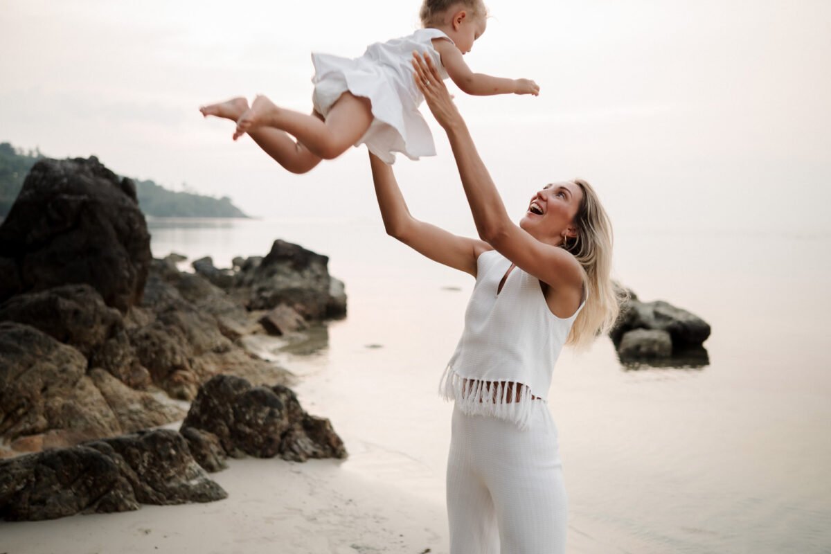Family playing on Koh Samui beach at sunset, natural family photography