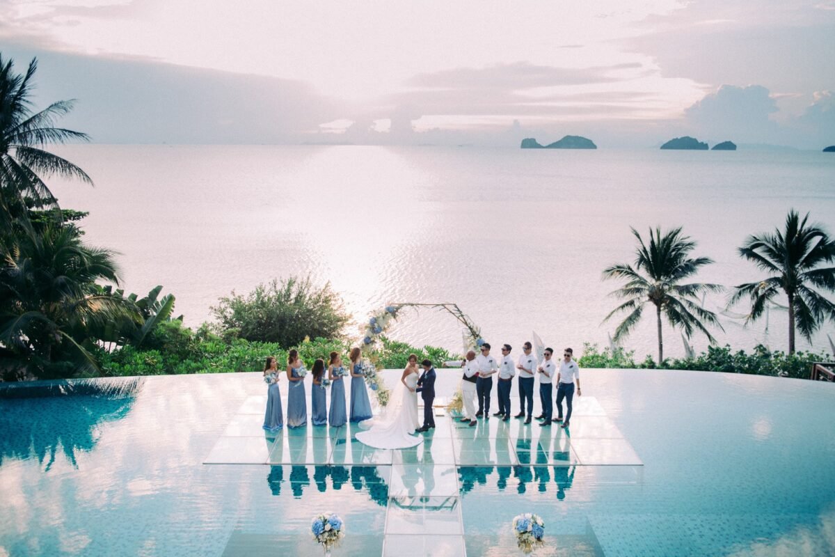 Beachfront infinity-pool villa wedding ceremony overlooking the sea on Koh Samui