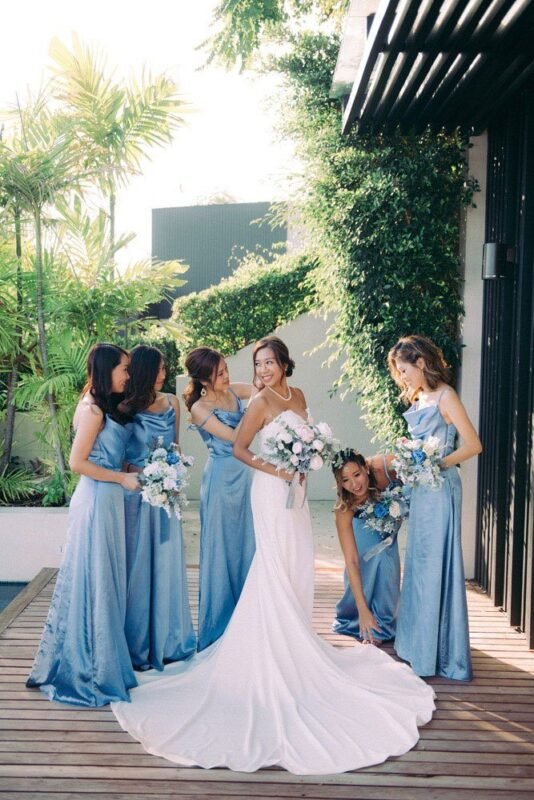 Bride with bridesmaids in blue on a villa terrace, Koh Samui wedding photography