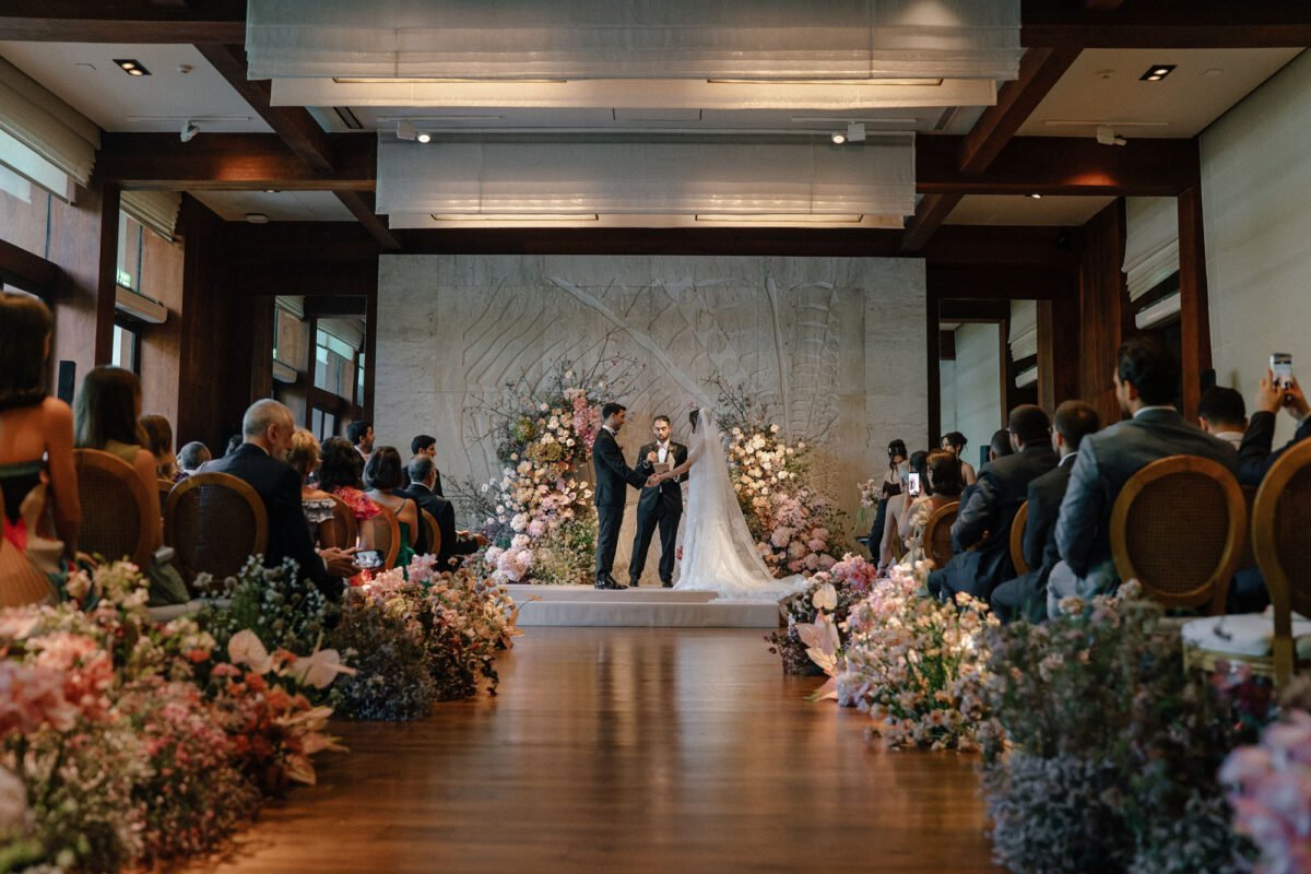 Elegant indoor resort wedding ceremony with florals on Koh Samui